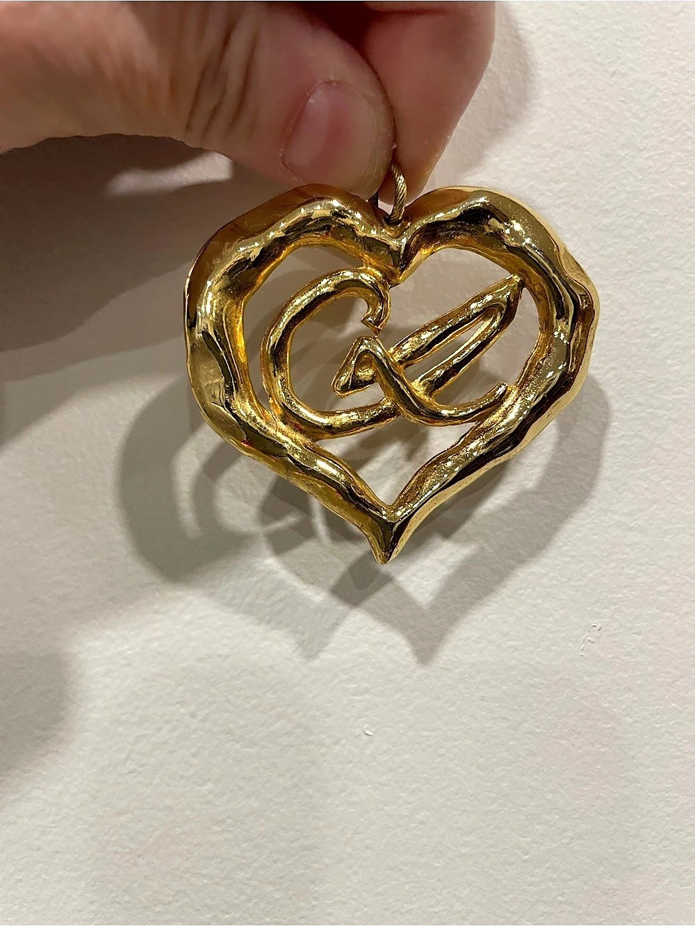 vintage Christian Lacroix gold-plated monogram heart pendant. 80’s runway